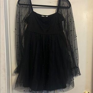 NWT Elegant Black Dress with Sheer Sleeves and black beads.